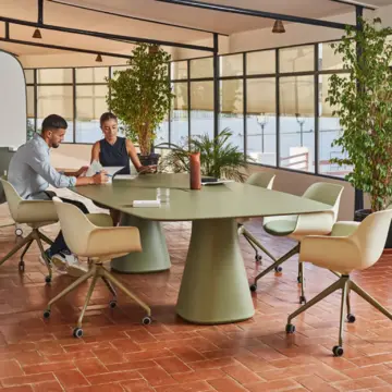 Table de réunion design Baelo à piètement sculptural ambiance vert